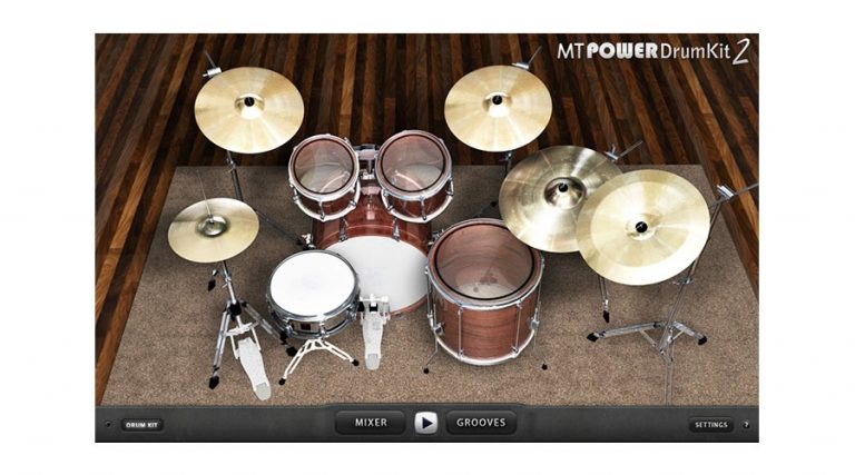 Screenshot of the MT Power Drum Kit 2 software interface. This setup features a snare, bass, toms, hi-hat, crash, ride, and splash cymbals. All these components are arranged in a typical configuration and placed on a wooden platform with a rug underneath.