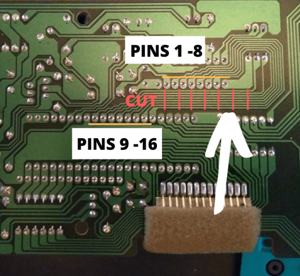 A close-up view of a circuit board reveals a component with intricately labeled areas alongside detailed instructions. The top section, marked "PINS 1-8," contrasts with the lower section, labeled "PINS 9-16." Red lines and the word "CUT" clearly indicate where to sever the traces between these two pin sections for proper modification or repair.