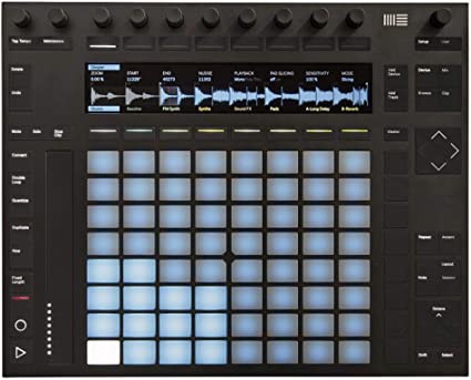 Product photo of the Ableton Push 2. A grid of 64 backlit pads, accompanied by an array of buttons, rotary knobs, and a small display screen illustrating waveform information.