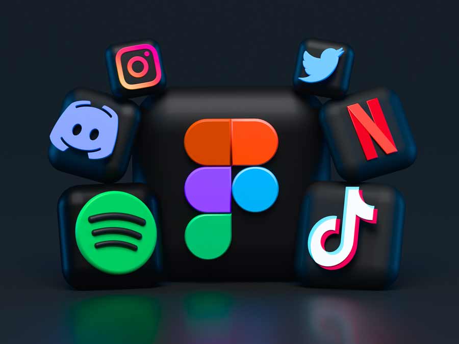 Illustrating a 3D collage, various popular social media and entertainment app icons such as Instagram, Twitter, Netflix, Discord, Spotify, TikTok, and Figma are arranged surrounding a central Figma logo against a dark backdrop.